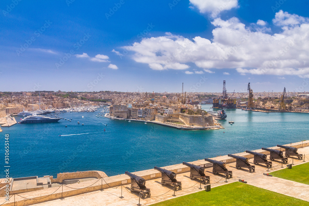 Upper Barrakka Gardens with The Saluting Battery. View of Valletta town with harbor, the capital of Malta, Europe.