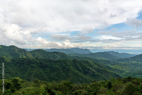 Fototapeta Naklejka Na Ścianę i Meble -  beautiful blue sky high peak mountains mist fog wildlife green forest at Khao Koh, Phu Tub Berk, Phetchabun, Thailand  guiding idea long weekend for backpacker camping campfire relaxing hiking