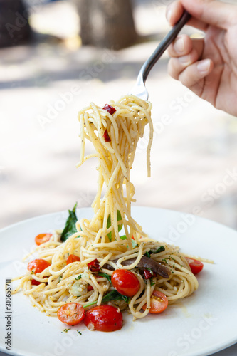 Spaghetti with anchovy, cherry tomato, onion, chili and pamersan cheese