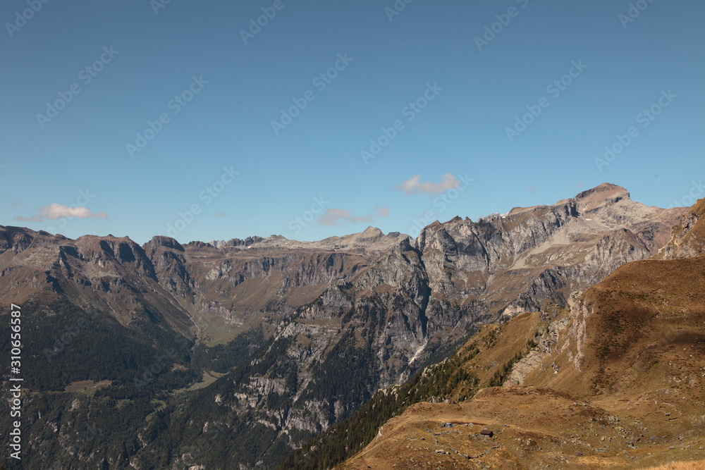 Beautiful mountain landscape with summits, valleys and waterfalls in the Swiss alps