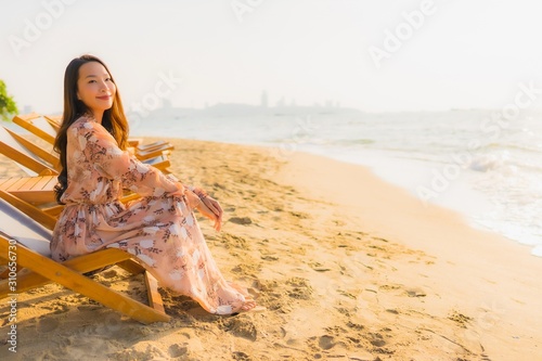 Portrait beautiful young asian women happy smile around outdoorn happy smile relax around tropical beach sea photo