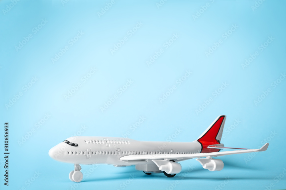 Toy plane on blue background, space for text. Logistics and wholesale concept