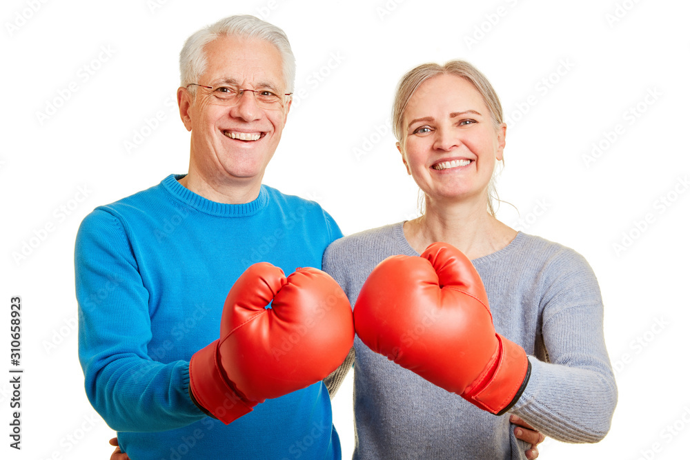 Senior couple with red boxing gloves Senior couple with red boxing gloves