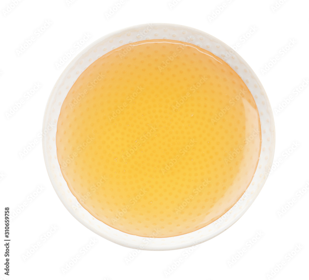 Bowl of organic honey isolated on white, top view Bowl of organic honey isolated on white, top view