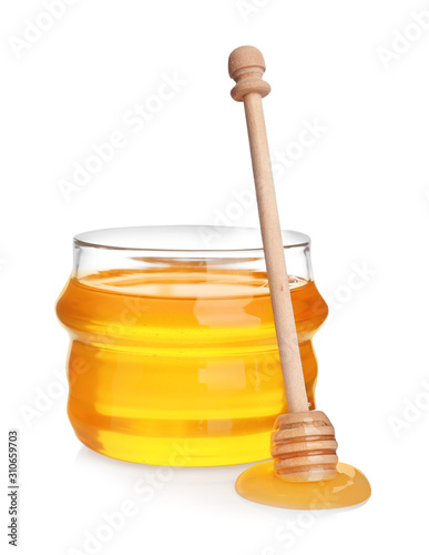 Jar of organic honey and dipper isolated on white