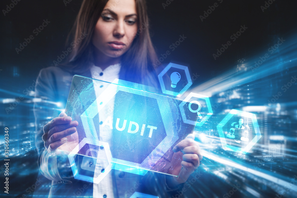 Business, Technology, Internet and network concept. Young businessman working on a virtual screen of the future and sees the inscription: Audit Business, Technology, Internet and network concept. Young businessman working on a virtual screen of the future and sees the inscription: Audit