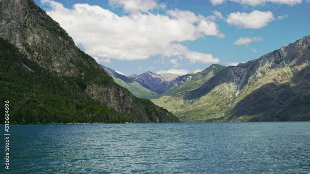 Enchanting View of a Lake and the Mountain Ranges in the Background Enchanting View of a Lake and the Mountain Ranges in the Background