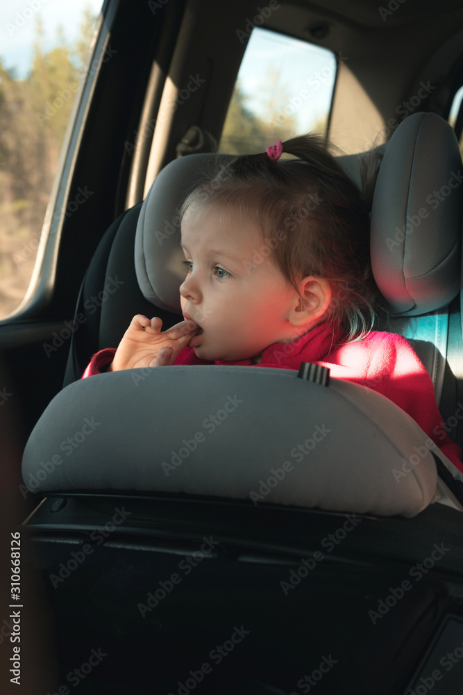 bored little girl in car seat. auto trip. bored little girl in car seat. auto trip.