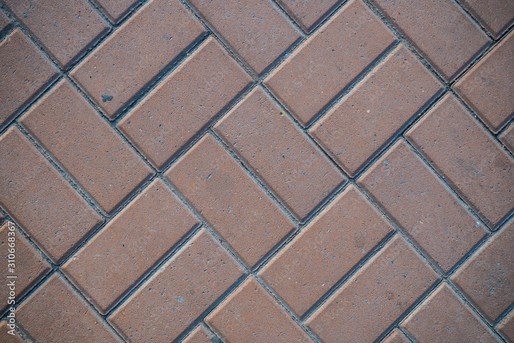 Texture of paving slabs overgrown with grass. Background image of a stratum stone Texture of paving slabs overgrown with grass. Background image of a stratum stone