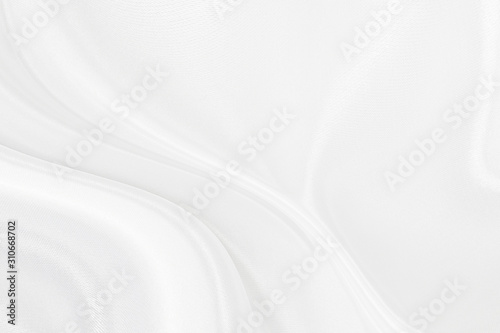 White gray satin texture that is white silver fabric silk background with beautiful soft blur pattern natural.