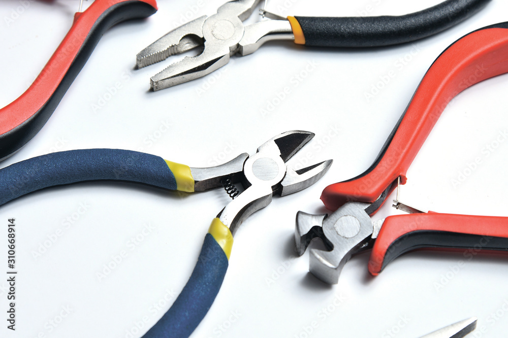 Set of different tools for crimping cables. Set of pliers and wire cutters. Set of different tools for crimping cables. Set of pliers and wire cutters.