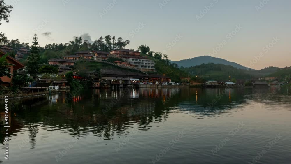 Time lapse of Ban Rak Thai Chinese village and reflection on pond at twilight in Mae Hong Son Thailand Time lapse of Ban Rak Thai Chinese village and reflection on pond at twilight in Mae Hong Son Thailand