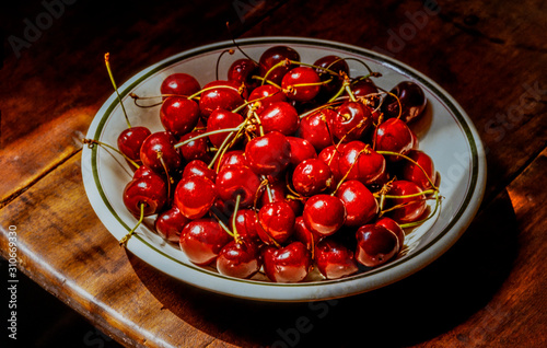 Fresh cherries on bowl photo