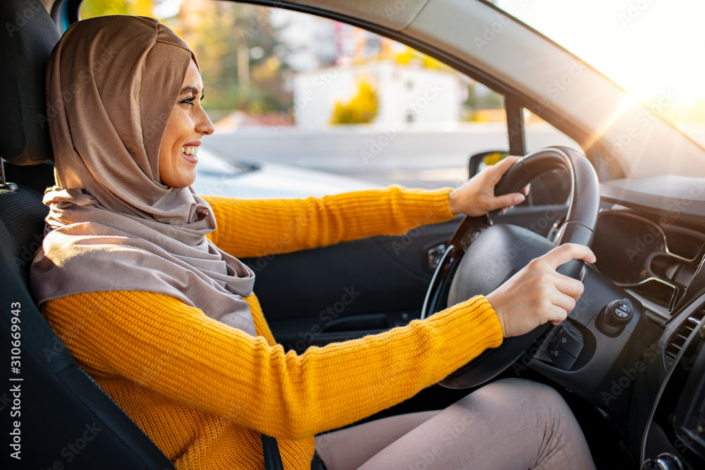 Beautiful Young Happy Smiling Muslim Woman Driving Her New Car At Sunset Young Muslim Woman On