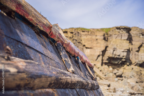 Korean fishing boats washed ashore at Tobizin Cape, Russian Island, Vlaivostok photo