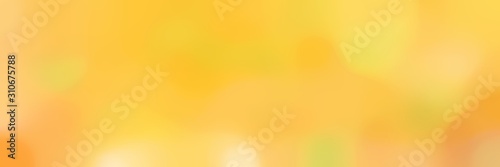 soft blurred horizontal background with pastel orange, khaki and vivid orange colors and free text space