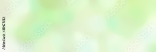 blurred horizontal background with tea green, beige and honeydew colors and space for text