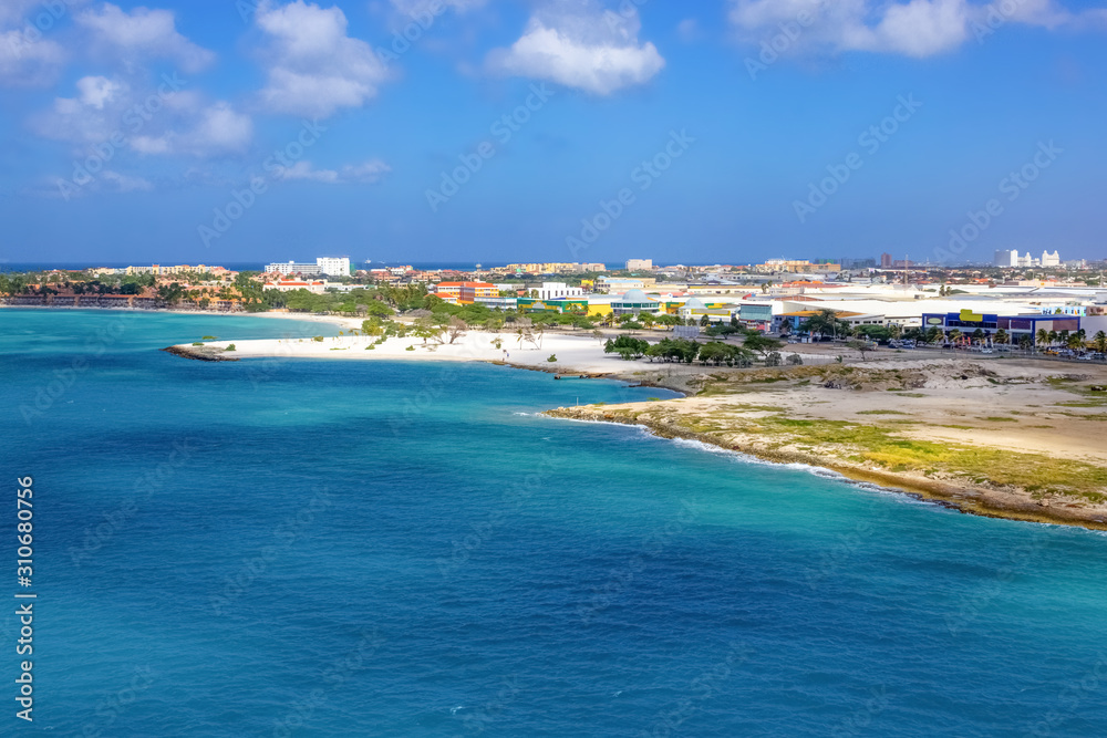 View of the main harbor on Aruba looking from a cruise ship down over the city and boats. Dutch province named Oranjestad, Aruba - beautiful Caribbean Island.