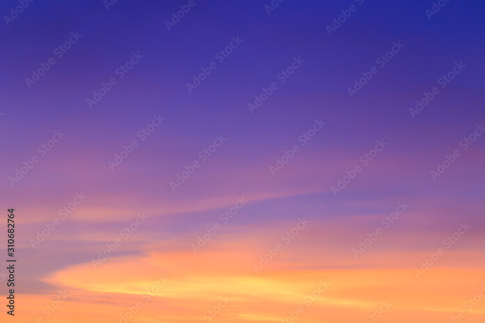 Abstract fantasy twilight sunset background, Golden sunlight cloudy with colorful highlight on blue sky and softly clouds 