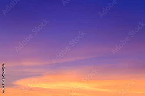 Abstract fantasy twilight sunset background, Golden sunlight cloudy with colorful highlight on blue sky and softly clouds 