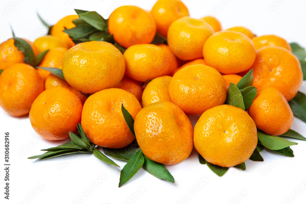 Bright tangerines on a white isolated background. Bright tangerines on a white isolated background.