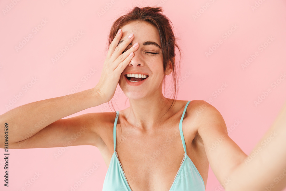 Beautiful young slim girl wearing bikini standing isolated Beautiful young slim girl wearing bikini standing isolated