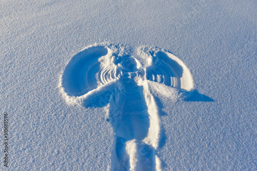 snow angel painted on pristine snow