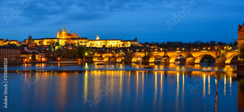 Photography Prague skyline and bridge over river in night