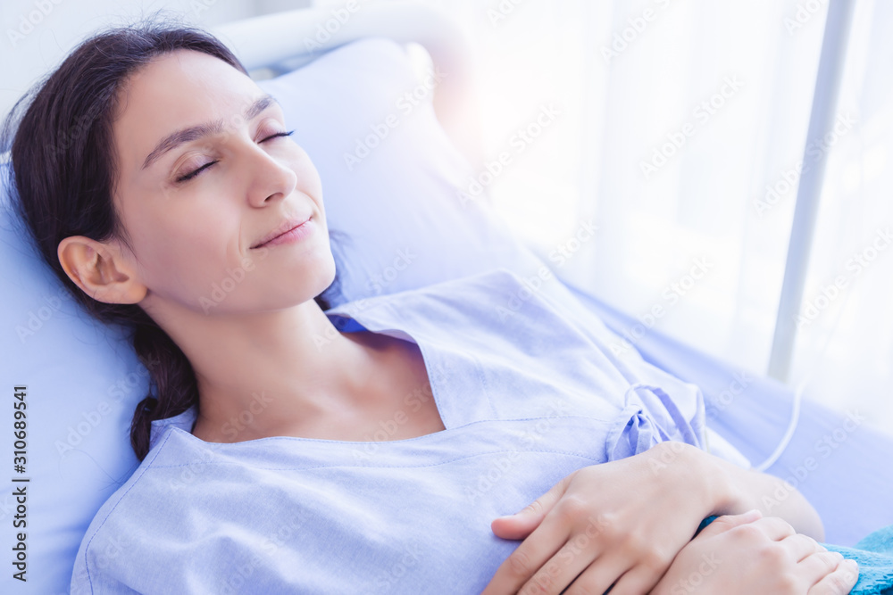 Patient woman feel safe, happy with smile face when sick lady sleep in hospital room. She recuperate for while. Patient female getting better, getting well and nearly go back home. She get sweet dream Patient woman feel safe, happy with smile face when sick lady sleep in hospital room. She recuperate for while. Patient female getting better, getting well and nearly go back home. She get sweet dream