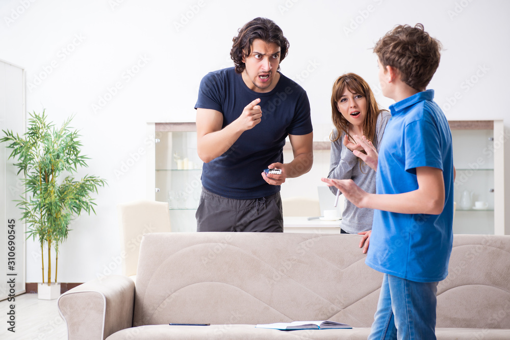 Fototapeta premium Concept of underage smoking with young boy and family