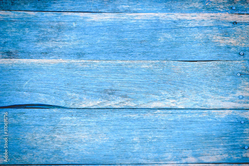 Wooden textured background, blue painted texture.