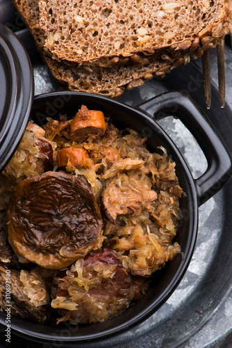 Traditional polish sauerkraut (bigos) with mushrooms and plums for christmas photo