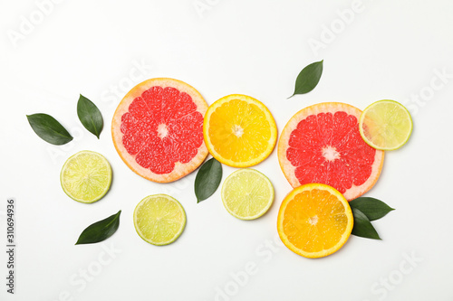 Fototapeta Naklejka Na Ścianę i Meble -  Flat lay with exotic fruits on white background, space for text