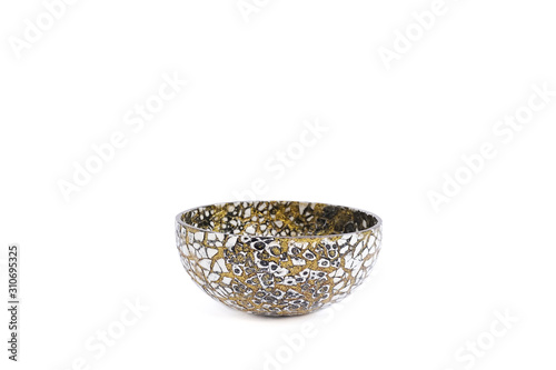 Mosaic bowl isolated on white background. Mosaic bowl in black and white with golden glitter. Mosaic product is popular souvenir from Morocco.