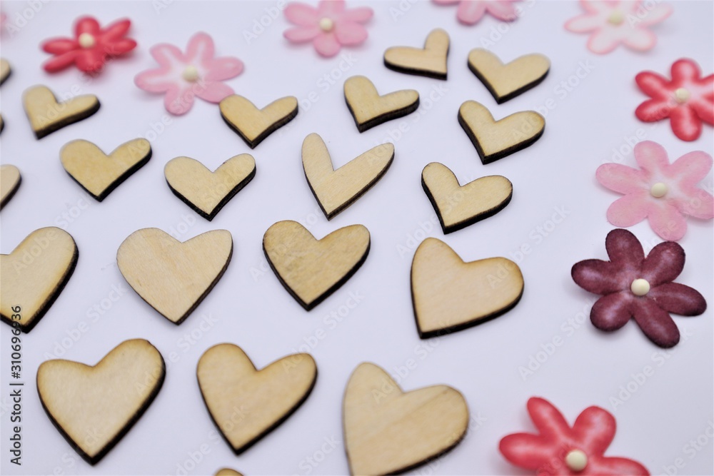 Fototapeta premium Valentines Day or wedding lovely concept wooden hearts with colorful paper flower background