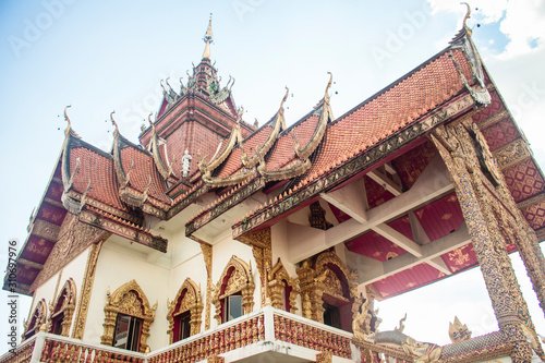 View to the upper floor of Wat Buppharam temple and the detailed traditional Thai style roof. In Chiang Mai, Thailand