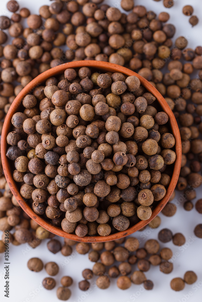 fresh spicy peppers allspice on white acrylic background fresh spicy peppers allspice on white acrylic background