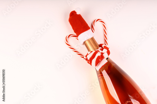 Christmas background. A bottle of red champagne. Top view. © Sergey