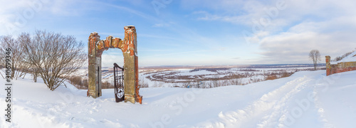 Panorama of the Oka River and the gate of an old manor in the Nizhny Novgorod region photo