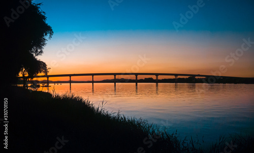 bridge on the horizon with sunset photo