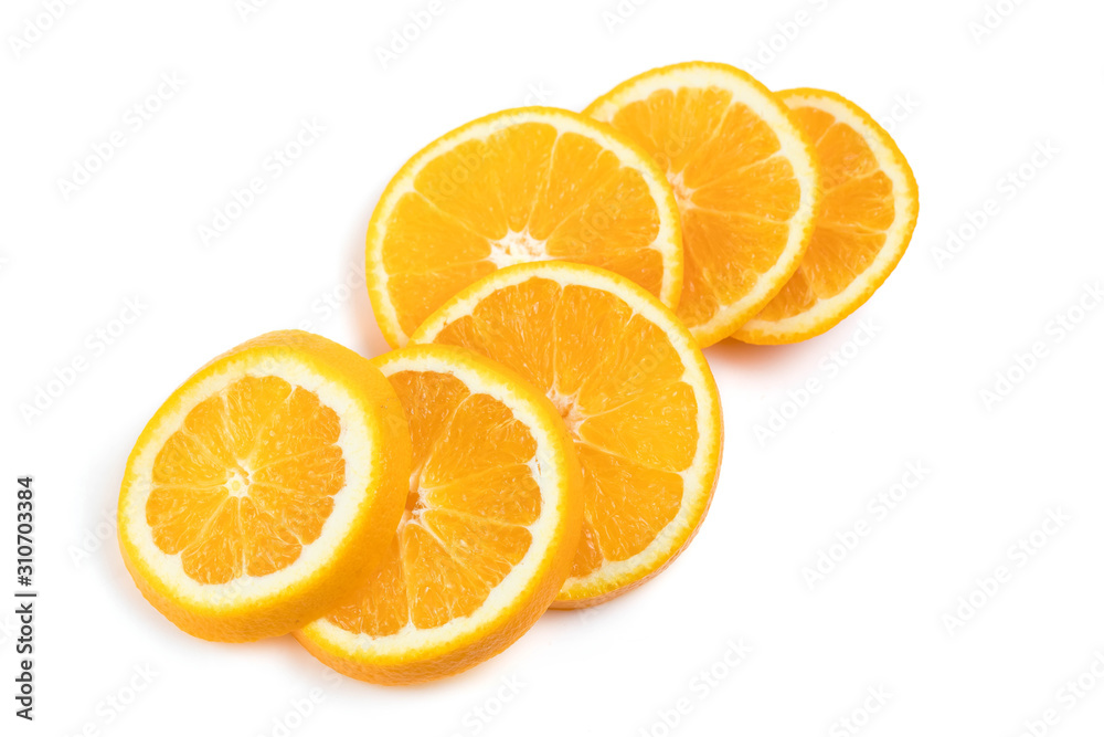 The juicy orange is cut across into round segments. The slices are folded in view of the timber on each other. White background The juicy orange is cut across into round segments. The slices are folded in view of the timber on each other. White background