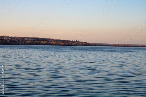 Lake with clear blue water in the city of Voronezh in the fall at sunset