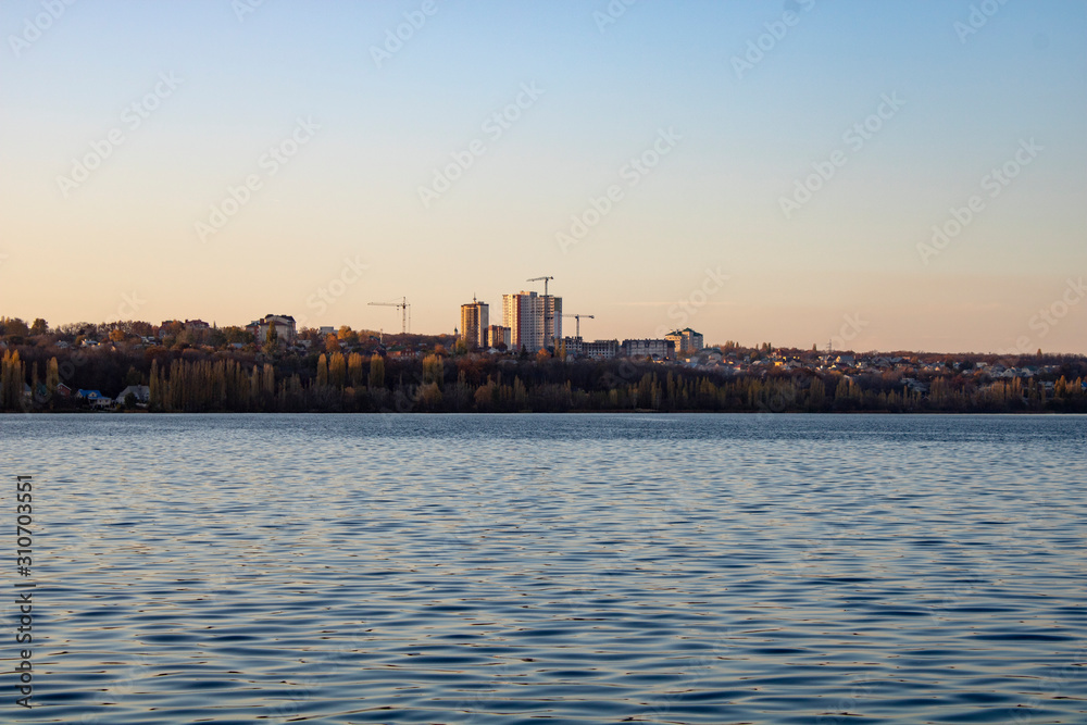 Lake with clear blue water in the city of Voronezh in the fall at sunset