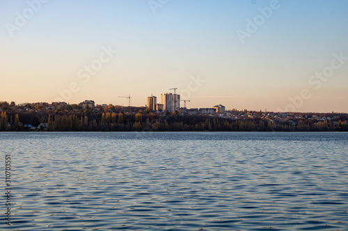 Lake with clear blue water in the city of Voronezh in the fall at sunset
