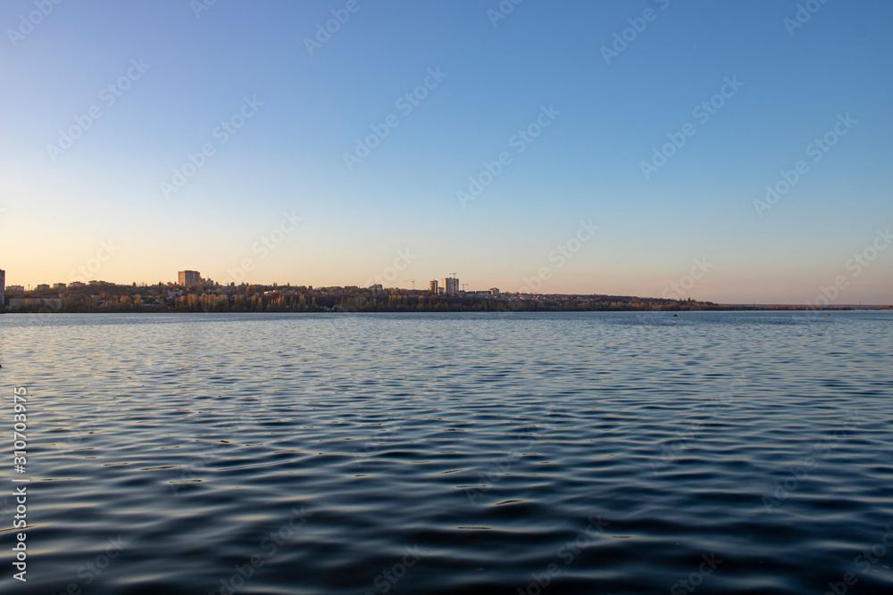 Lake with clear blue water in the city of Voronezh in the fall at sunset Lake with clear blue water in the city of Voronezh in the fall at sunset