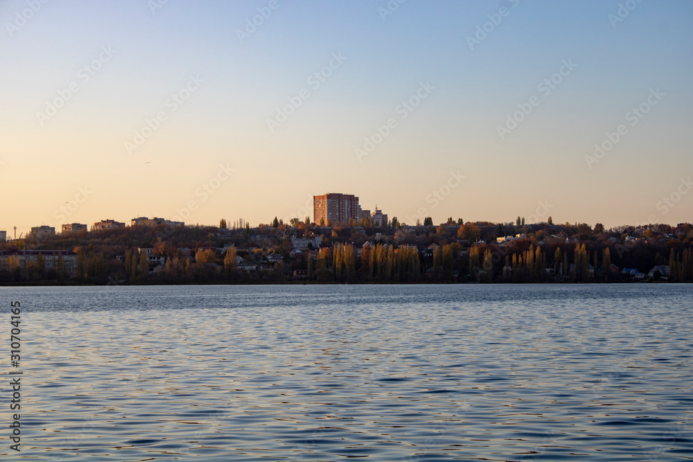 Lake with clear blue water in the city of Voronezh in the fall at sunset