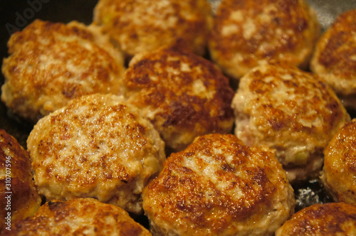 Fried meat cutlets rissole meatballs of minced pork in a pan.