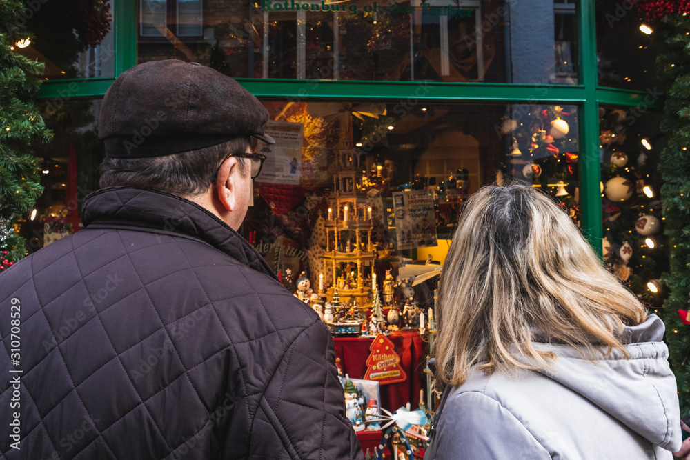 couple watching a christmas store