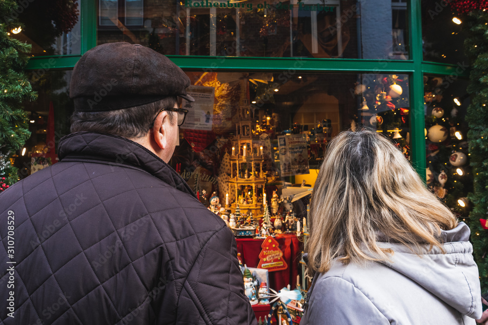 couple watching a christmas store couple watching a christmas store