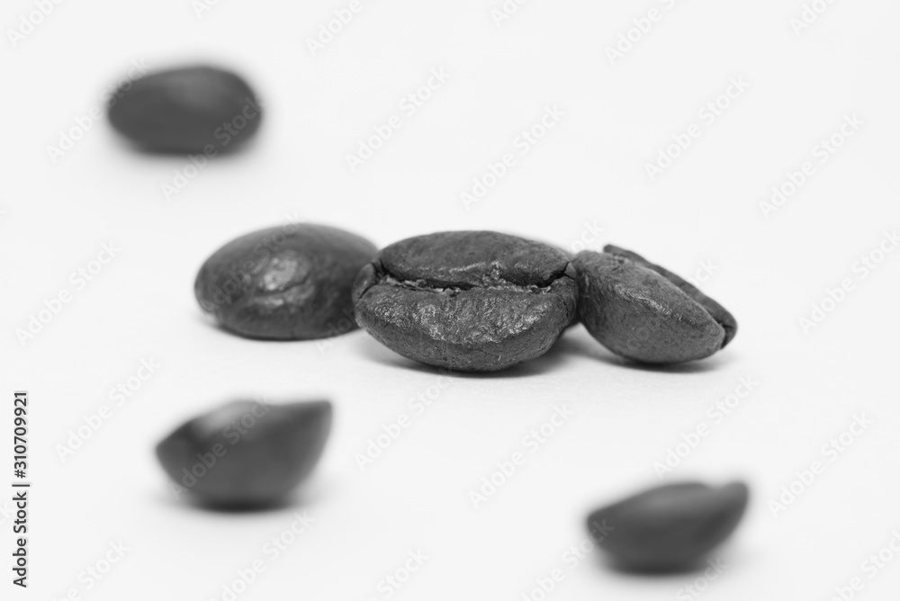 Close up of coffee beans on a white background Close up of coffee beans on a white background